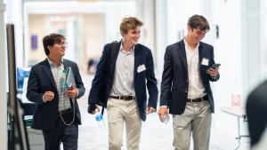 Students walk in a group at the SIEDS conference